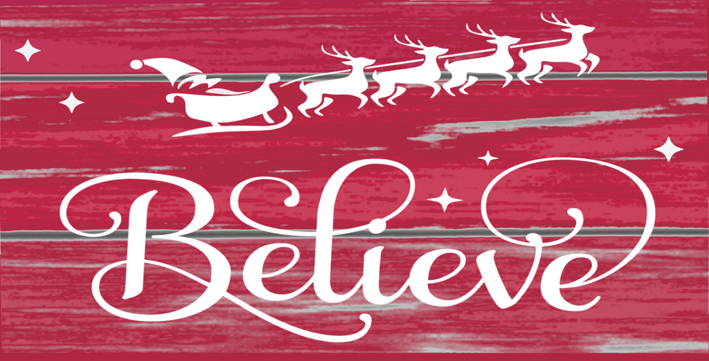 12 inch metal sign with Believe written in white and accented with Santa and his reindeer set against an aged red painted board