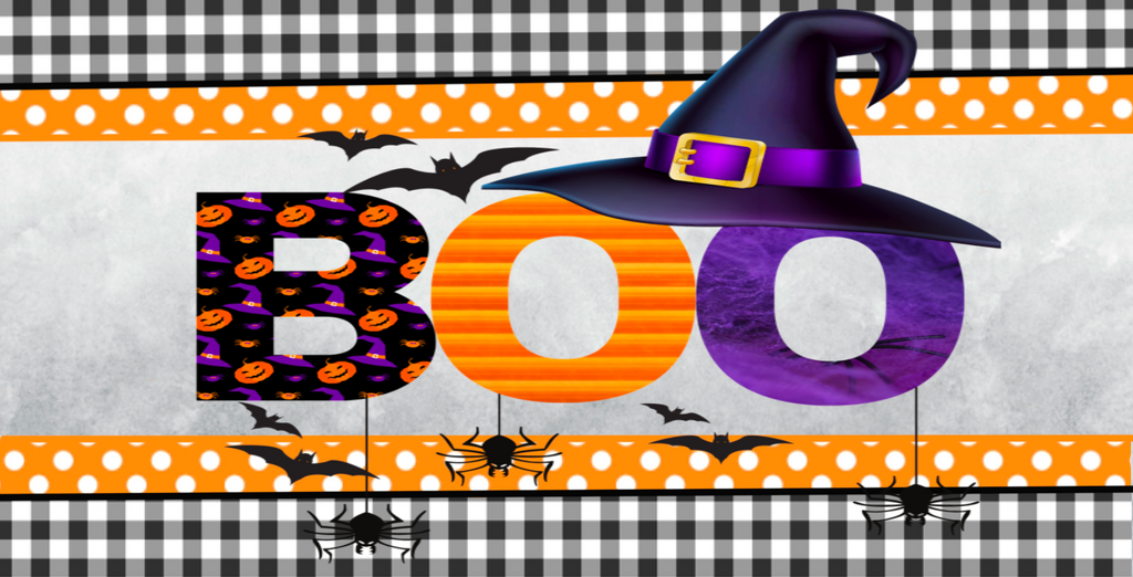 12 inch metal wreath sign with Boo printed atop a light gray watercolor background and accented with a witches hat, bats, spiders, polka dots and surrounded in a black and white gingham pattern