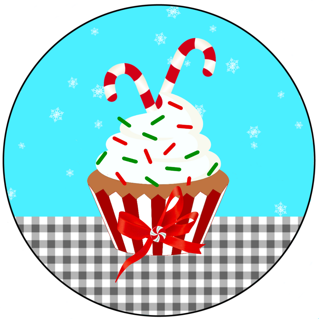 8 inch round metal wreath sign has a festive gingerbread cupcake topped with candy canes and red/white sprinkles with a turquoise blue backdrop accented by snowflakes and black and white gingham
