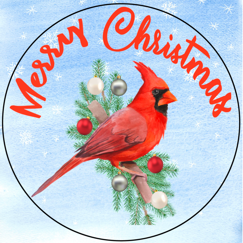 8 inch round metal wreath sign with Merry Christmas arched in red with a bright red cardinal sitting atop a pine bough against a watercolor light blue background accented with snowflakes