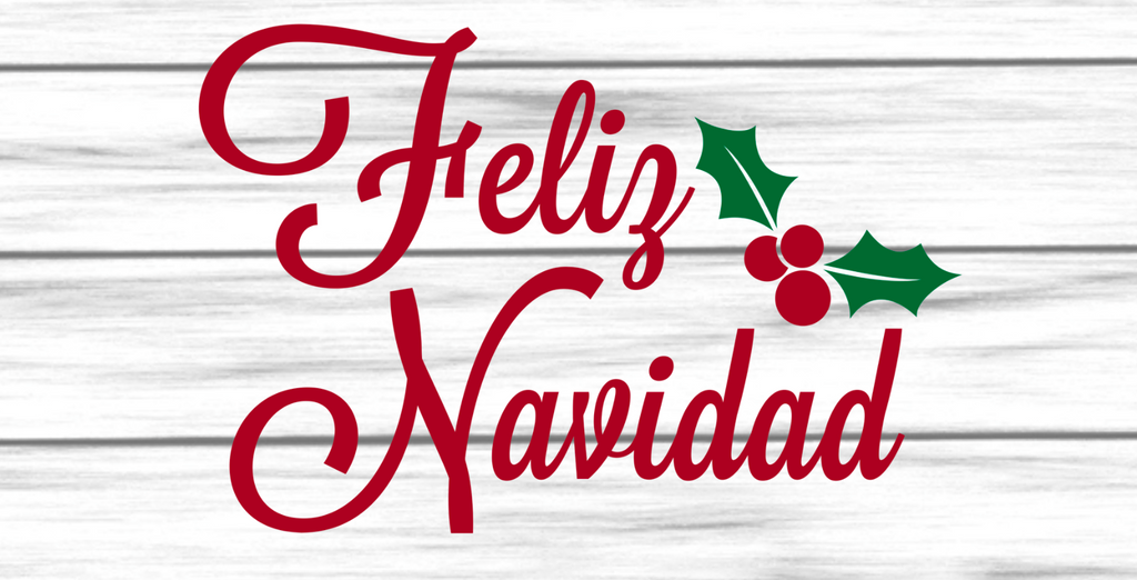 12 inch metal wreath sign with Feliz Navidad written in red and accented with a holly leaf with berries against a white shiplap background