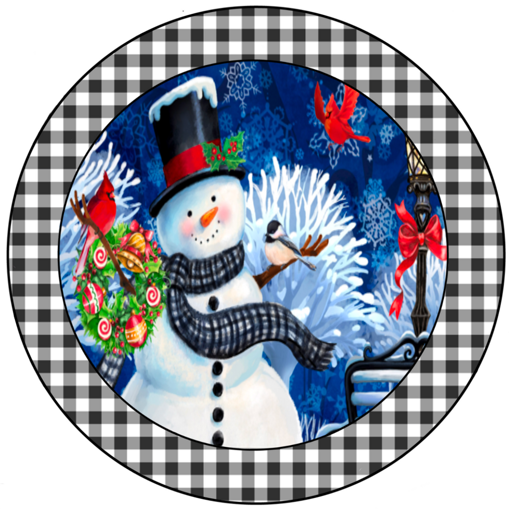 8" round wreath sign with a smiling snowman with cardinals surrounded by a black and white gingham plaid print.