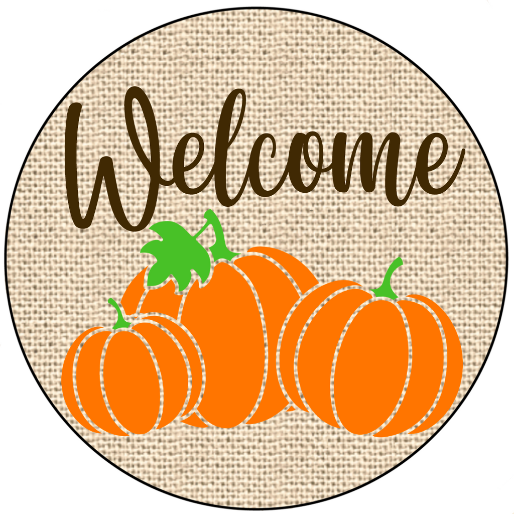 8 inch metal wreath sign with welcome printed in brown with a khaki burlap background with three accent pumpkins