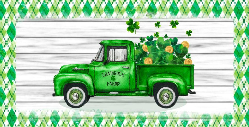 12 inch metal wreath sign with an antique green truck with shamrocks and gold coins in the bed set against a white-washed wooden background and surrounded by an aged green argyle pattern print