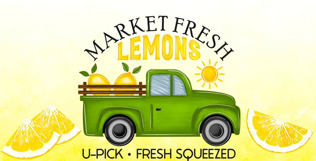 12 inch metal wreath sign featuring a green truck with lemons in the bed set against a light yellow background and accented with lemon slices